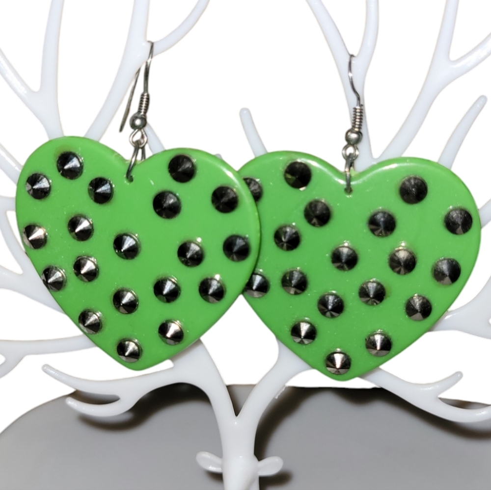 Stylish green heart-shaped earrings with decorative spike studs